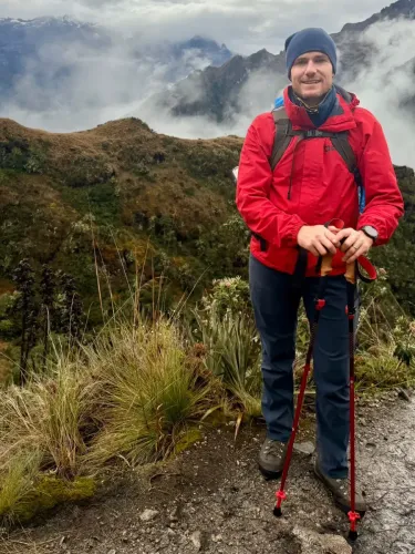Traveler hiking the Inca Trail through the mountains of Cusco