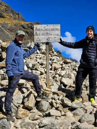 Travelers at Salkantay Pass during a trekking adventure in Cusco